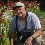 Bill Boothe the PhotoNaturalist beside Blooming Whitetop Pitcherplants